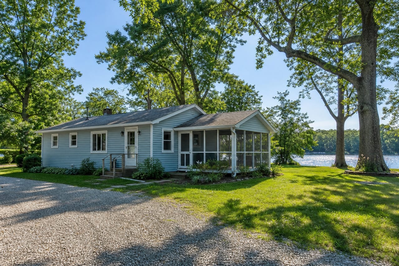 The bungalow from the drive, river behind