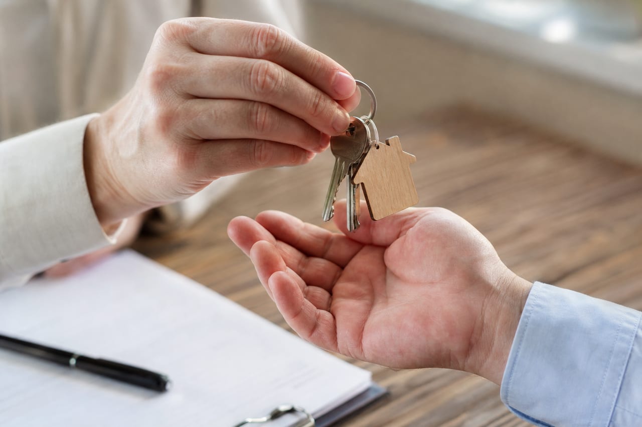 Keys being handed to a home buyer